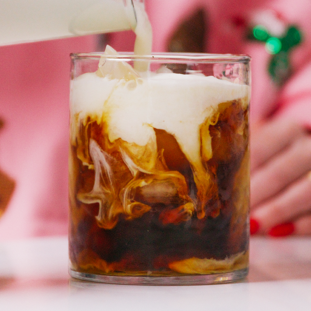 Glass of cold brew with peppermint cold foam on top