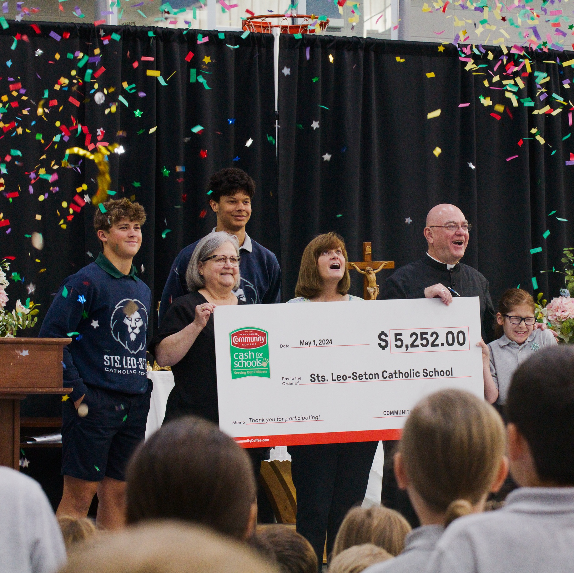 Community Coffee Cash for Schools winners posing with check