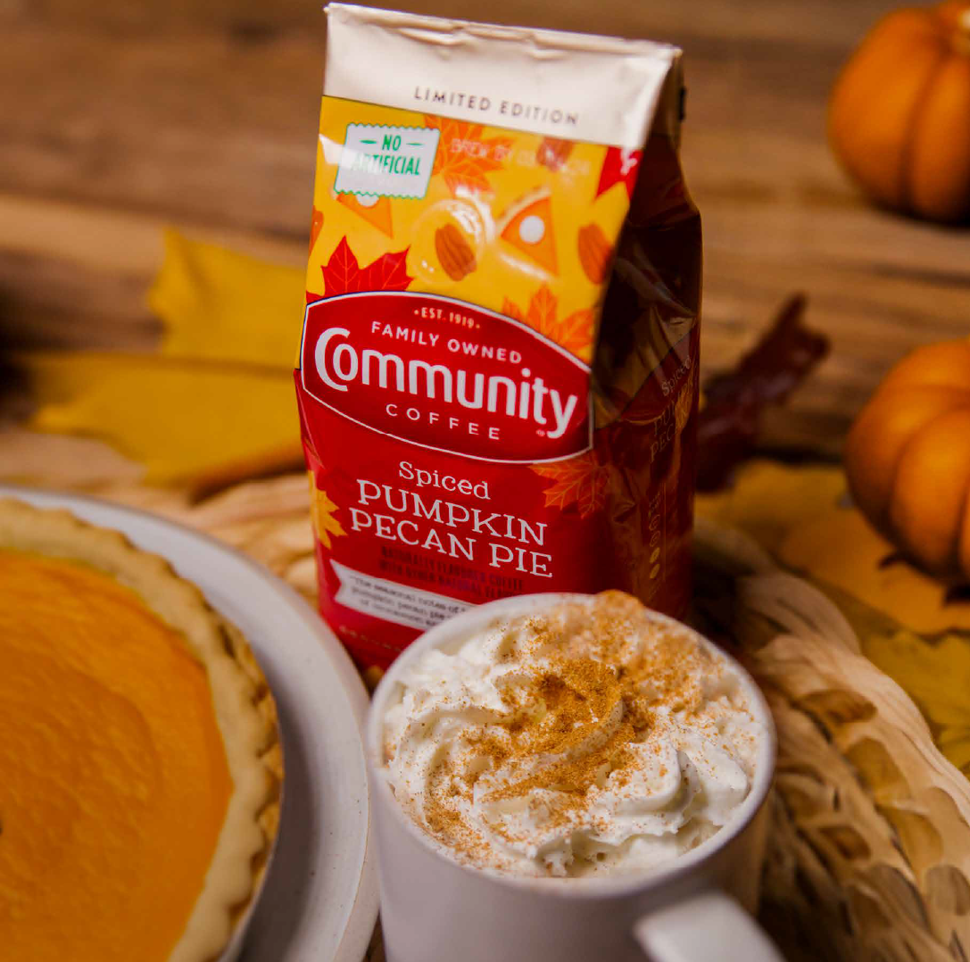 Community Coffee Spiced Pumpkin Pecan Pie latte next to pumpkin pie